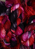 various red colour hand dyed merino cashmere sock yarn.