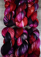 various red colour hand dyed merino cashmere sock yarn.