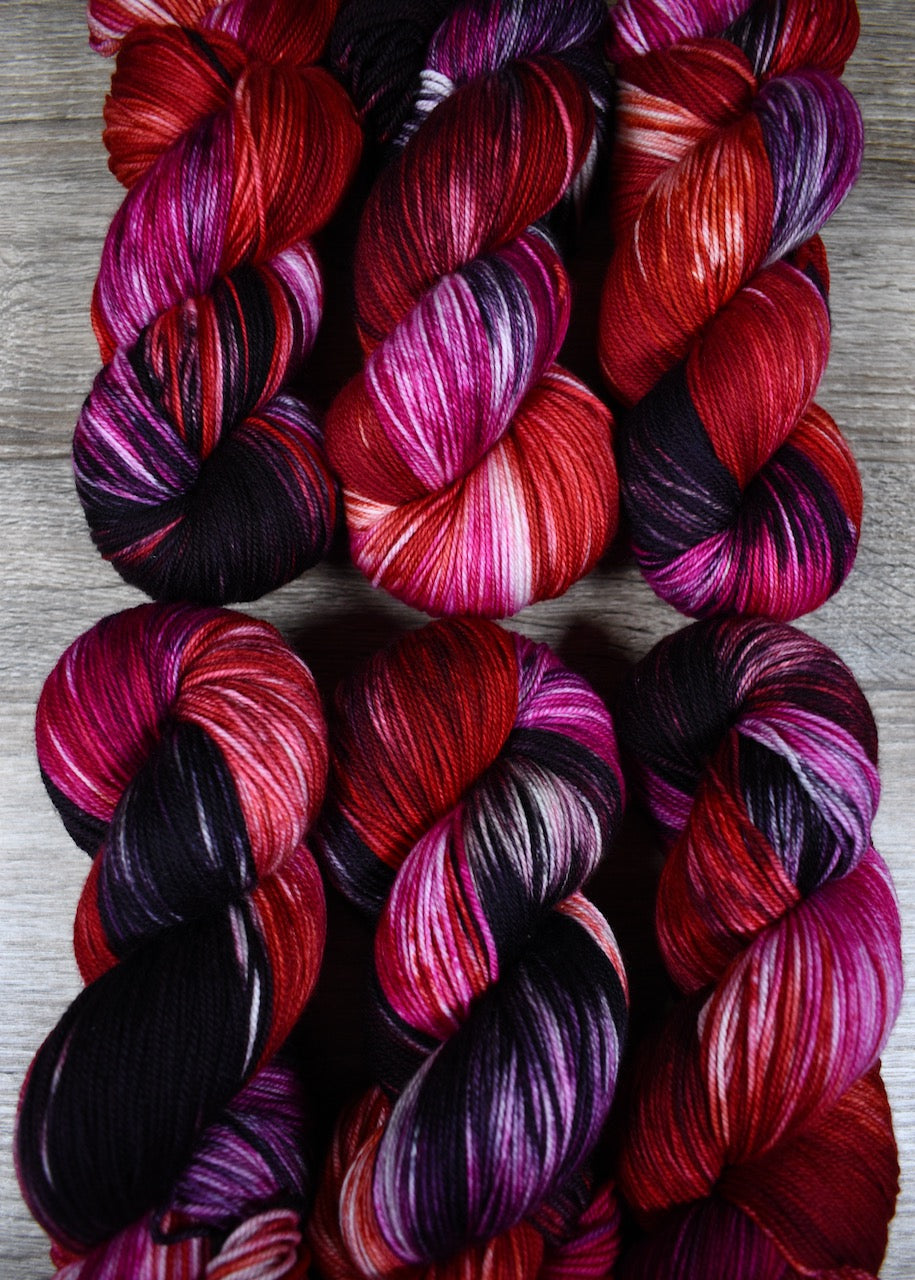 various red colour hand dyed merino cashmere sock yarn.