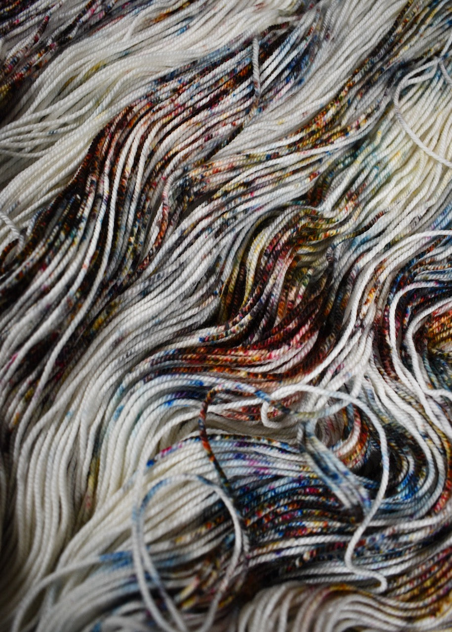 Blue pink and brown speckled hand dyed merino cashmere yarn.