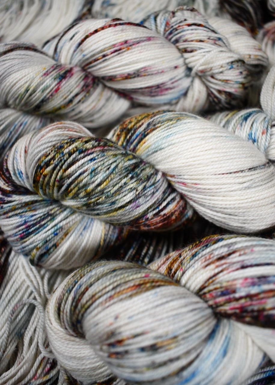 Blue pink and brown speckled hand dyed merino cashmere yarn.