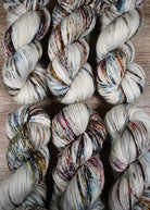 Blue pink and brown speckled hand dyed merino cashmere yarn.
