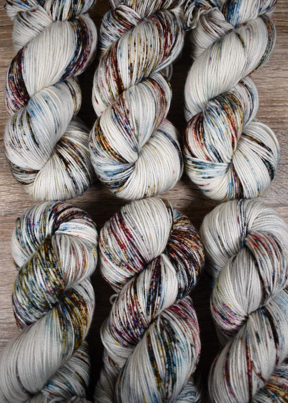 Blue pink and brown speckled hand dyed merino cashmere yarn.