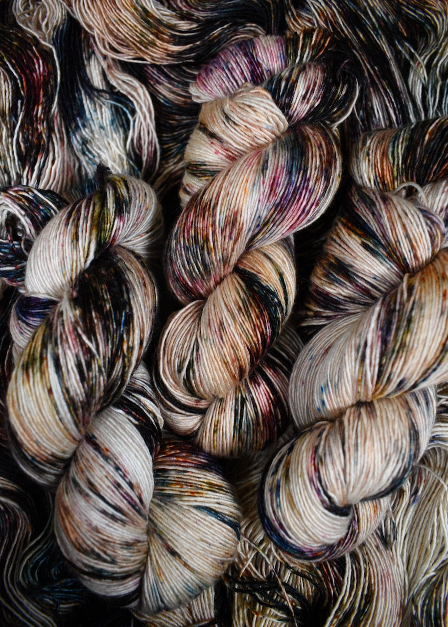 Speckled hand dyed merino cashmere silk yarn.