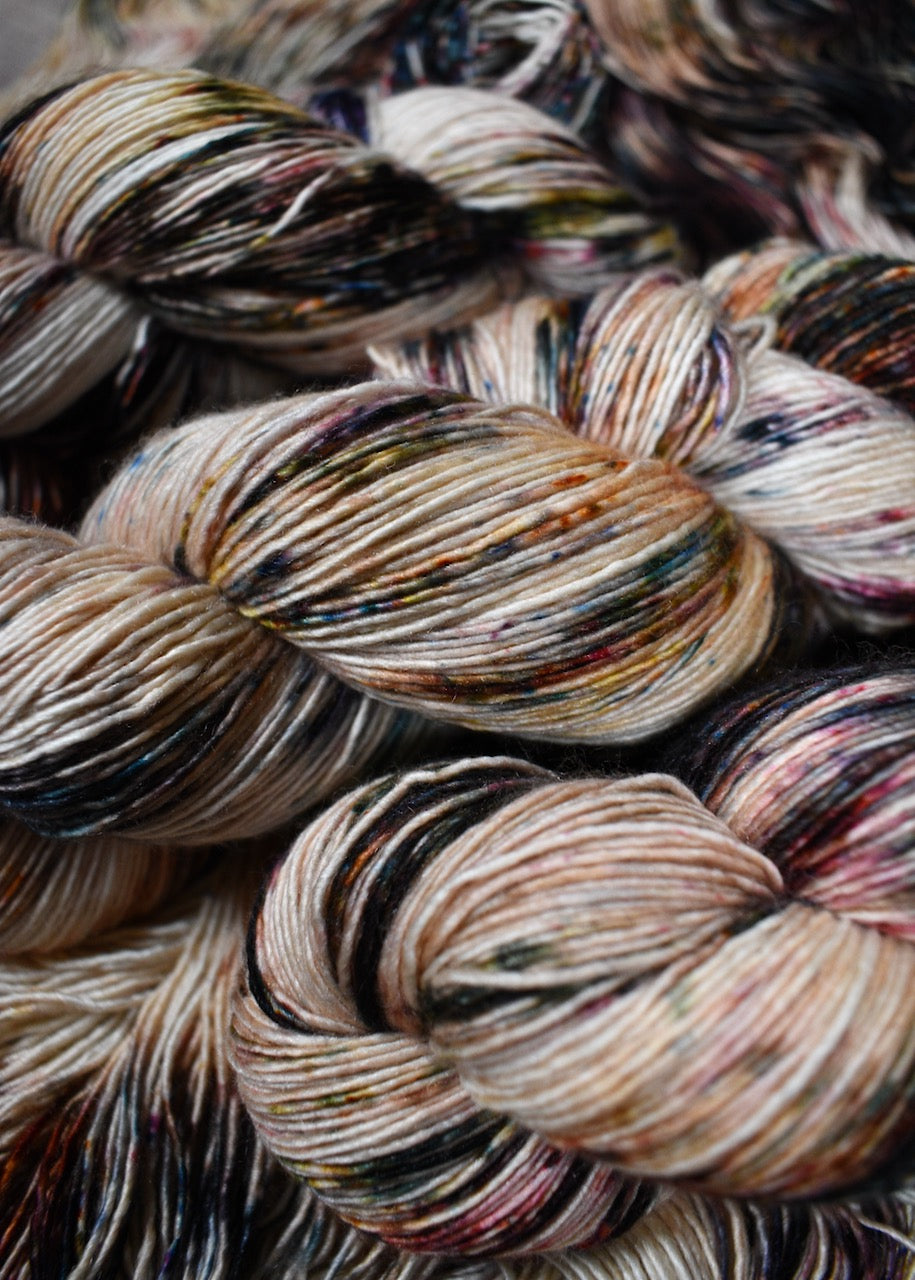 Speckled hand dyed merino cashmere silk yarn.