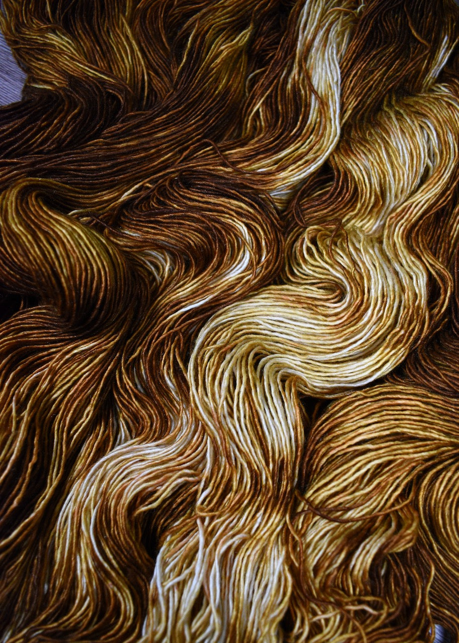 Golden yellow hand dyed merino cashmere yarn.