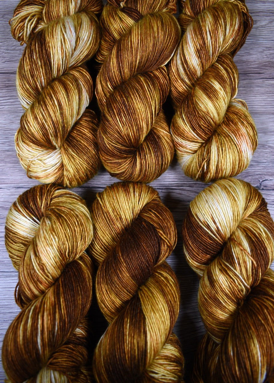 Golden yellow hand dyed merino cashmere yarn.