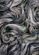 Bamboo sock yarn hand dyed with green speckles.