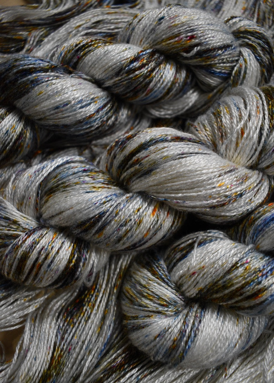 Speckled hand dyed bamboo sock yarn.