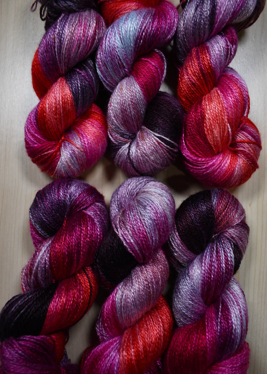 Hand dyed bamboo sock yarn in red colours.