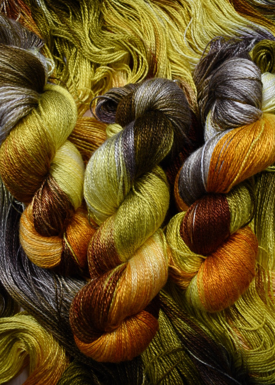 Hand dyed yellow bamboo sock yarn.