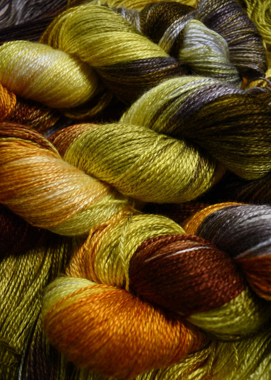 Hand dyed yellow bamboo sock yarn.