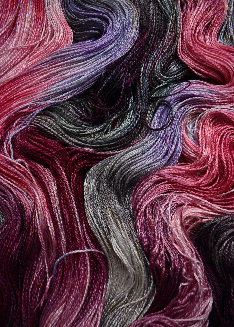 Hand dyed pink and purple bamboo sock yarn.