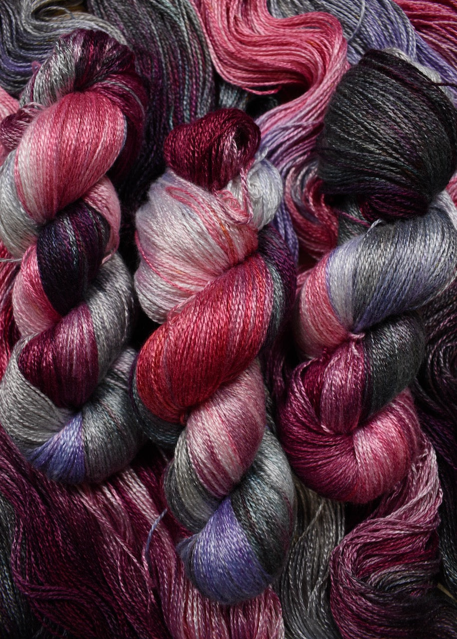 Hand dyed pink and purple bamboo sock yarn.