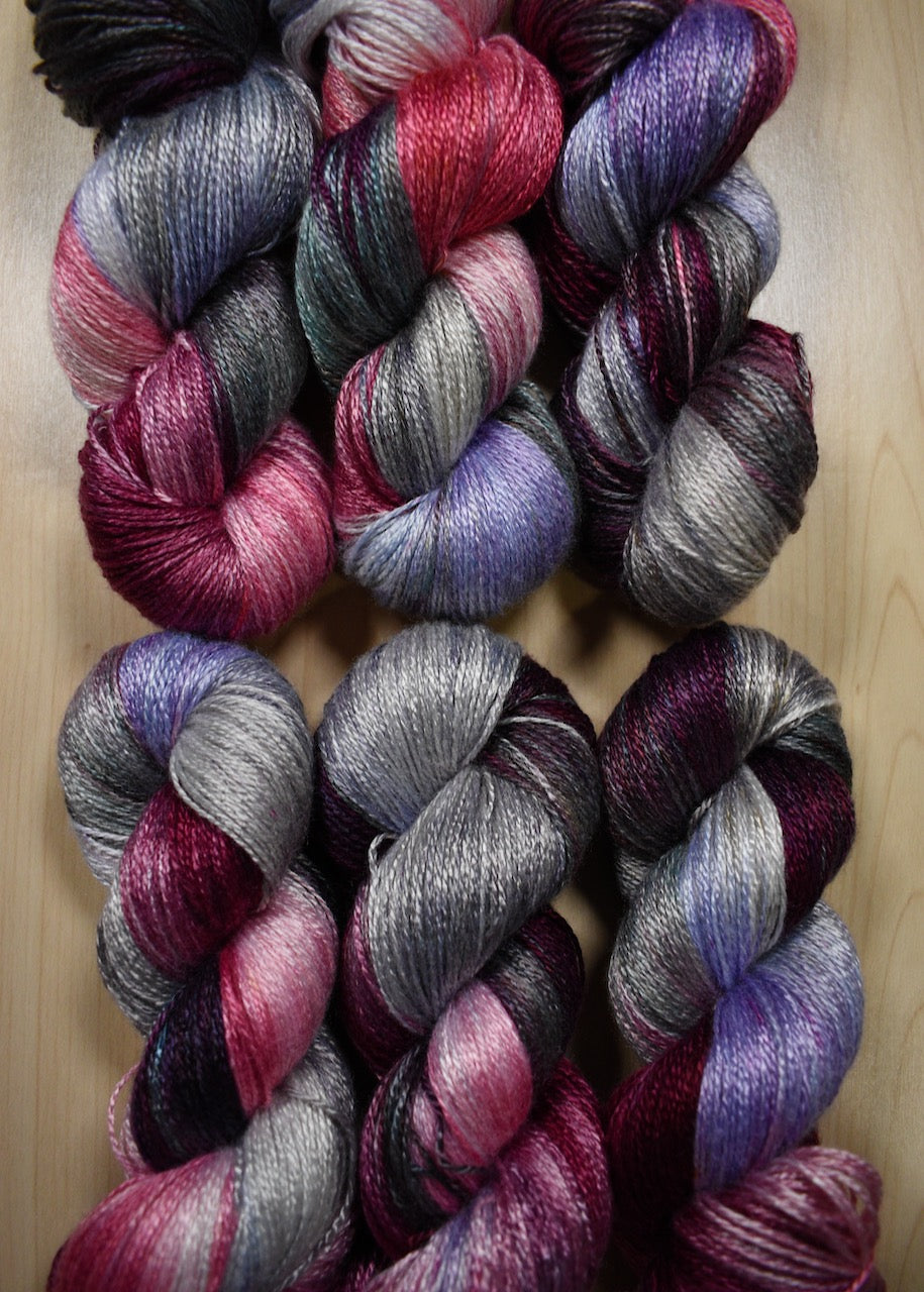 Hand dyed pink and purple bamboo sock yarn.