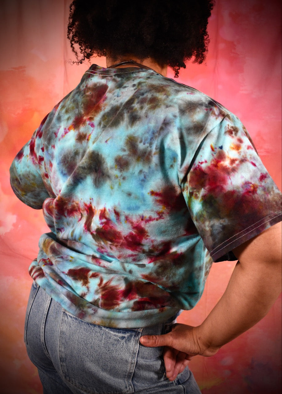 Hand dyed ice dye green turquoise and red cotton t-shirt.