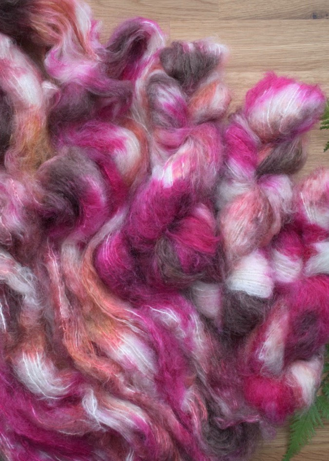 Pink speckled hand dyed dk weight mohair yarn.