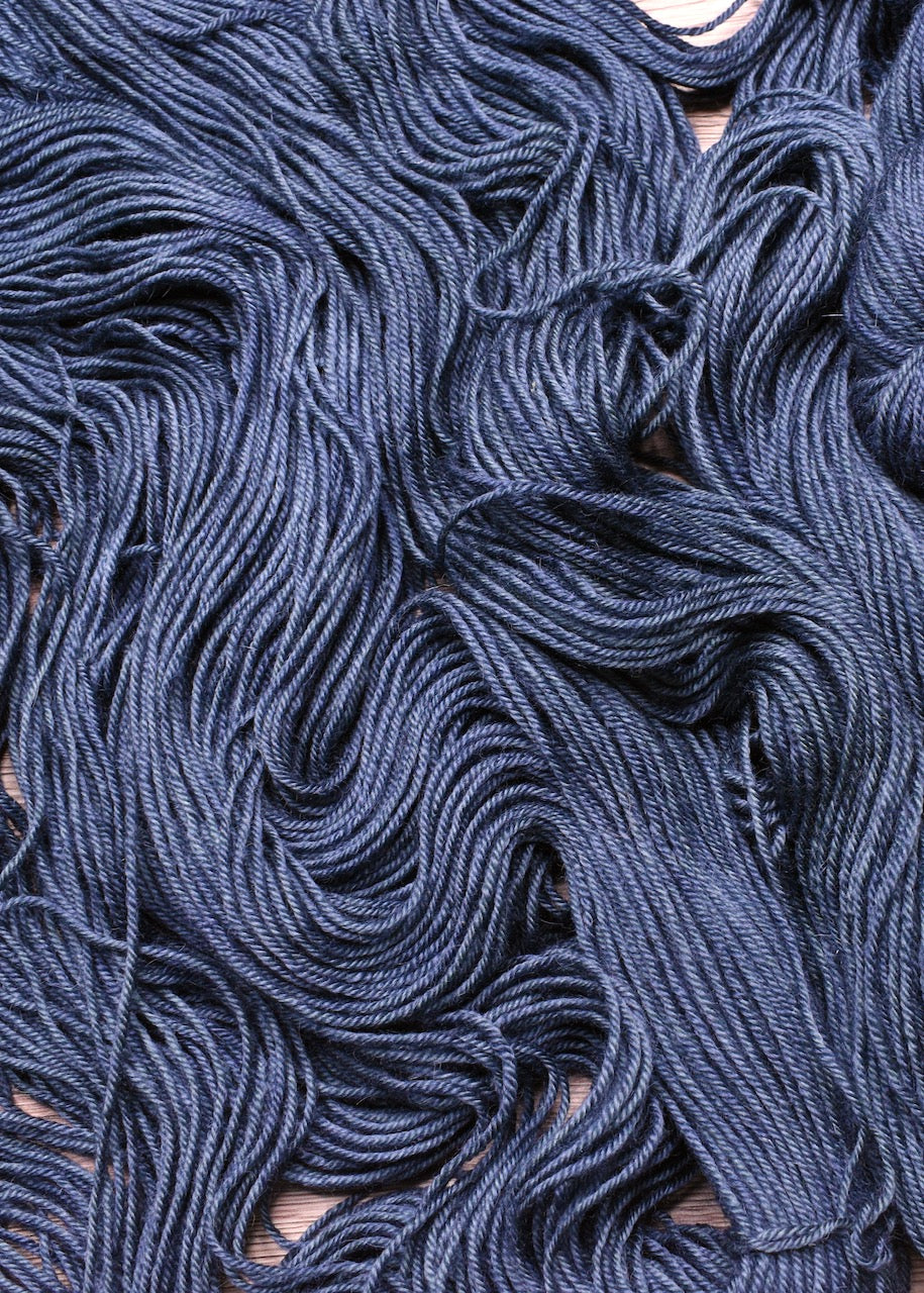 Blue gray hand dyed bfl worsted wool yarn.