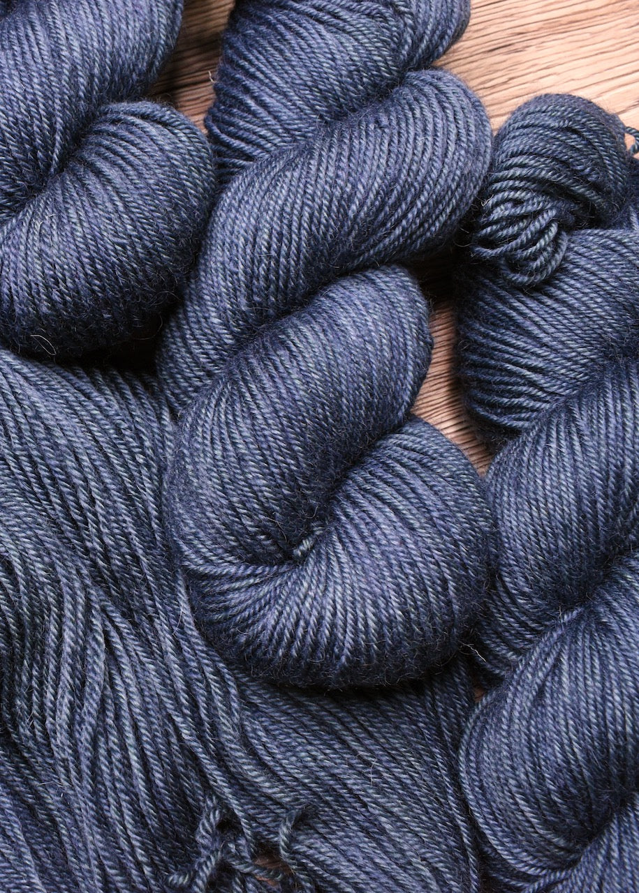 Blue gray hand dyed bfl worsted wool yarn.
