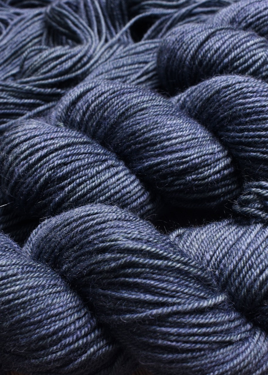 Blue gray hand dyed bfl worsted wool yarn.