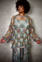 Crochet lace sweater pattern using hand dyed silk yarn.