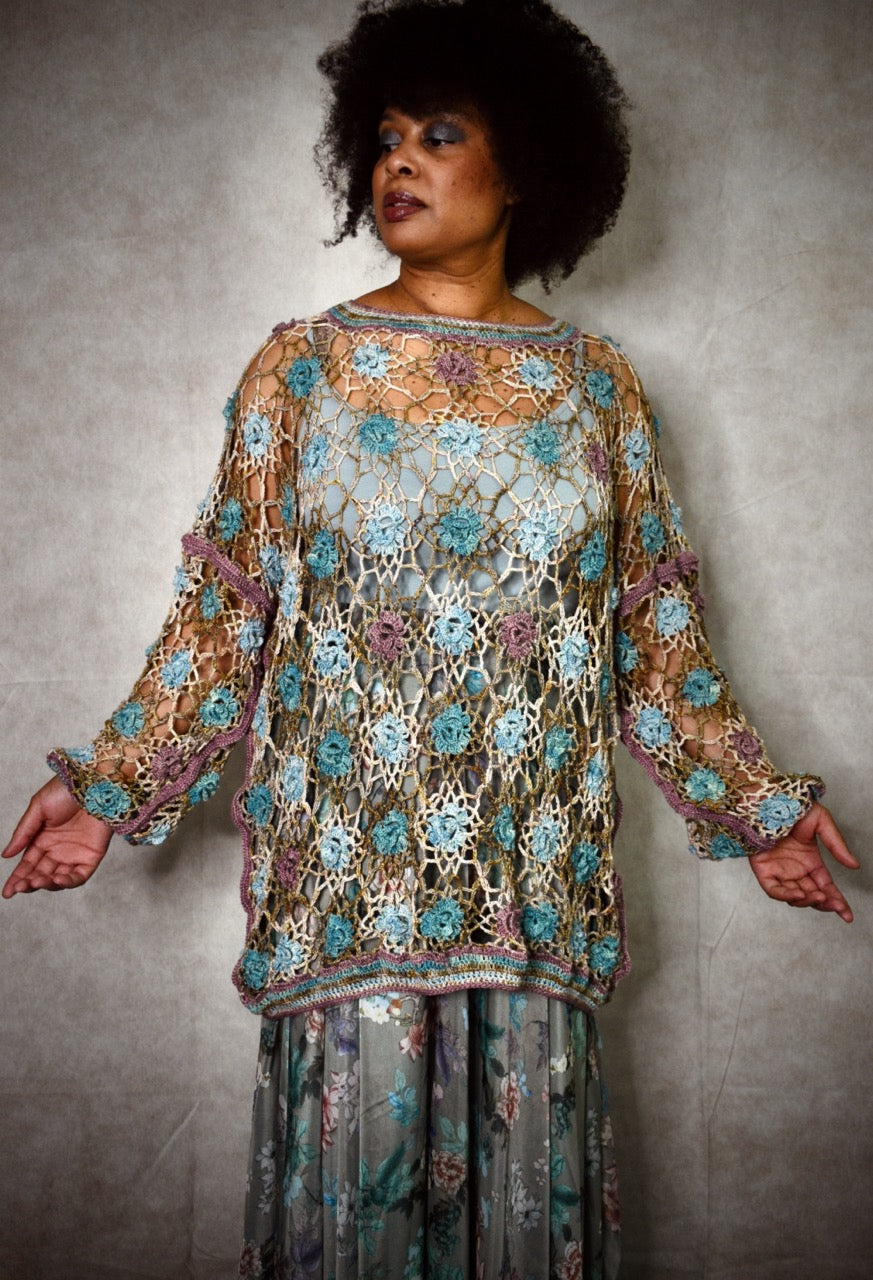 Crochet lace sweater pattern using hand dyed silk yarn.
