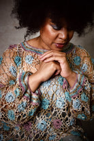 Crochet lace sweater pattern using hand dyed silk yarn.