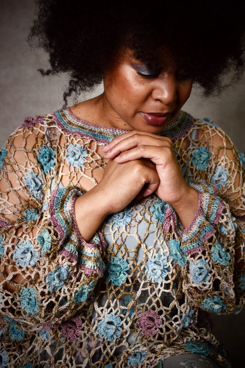 Crochet lace sweater pattern using hand dyed silk yarn.
