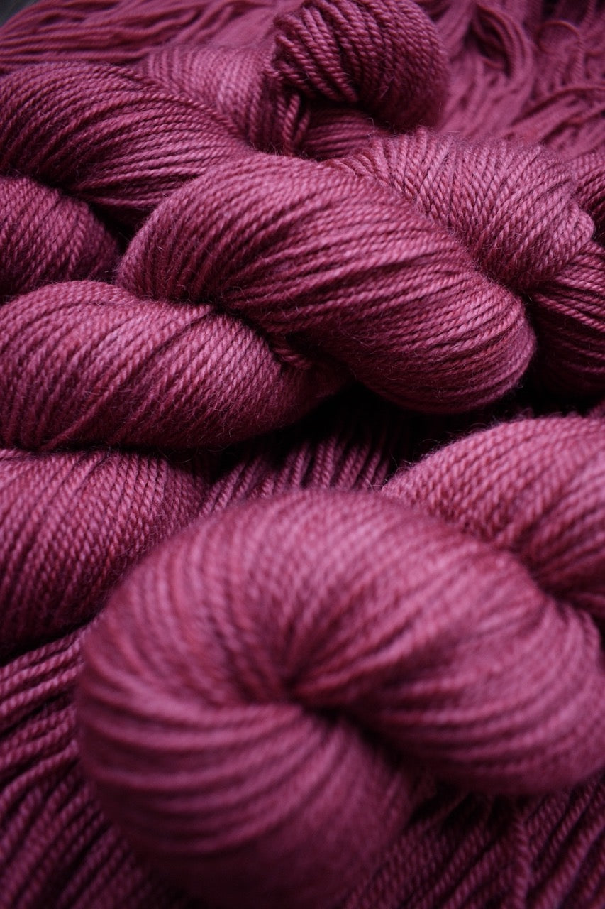 Wool yarn bfl hand dyed deep pink colour.