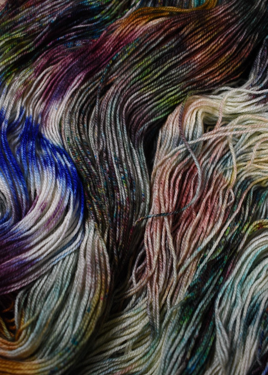 A variety of colour speckles on hand dyed bfl wool sock yarn.