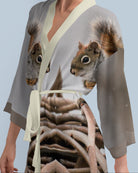 Woman wearing a kimono-style robe with a photo print squirrel design