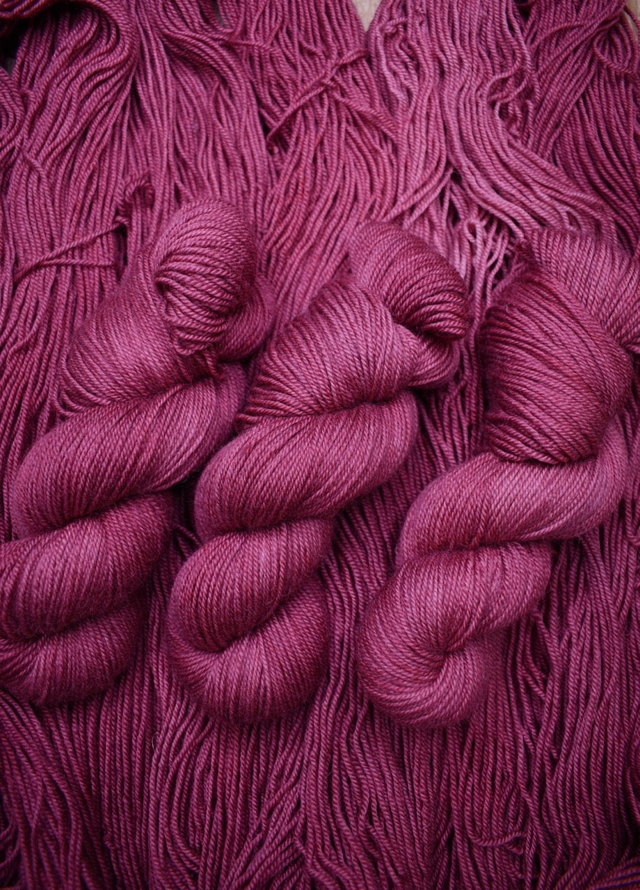 Wool yarn bfl hand dyed deep pink colour.