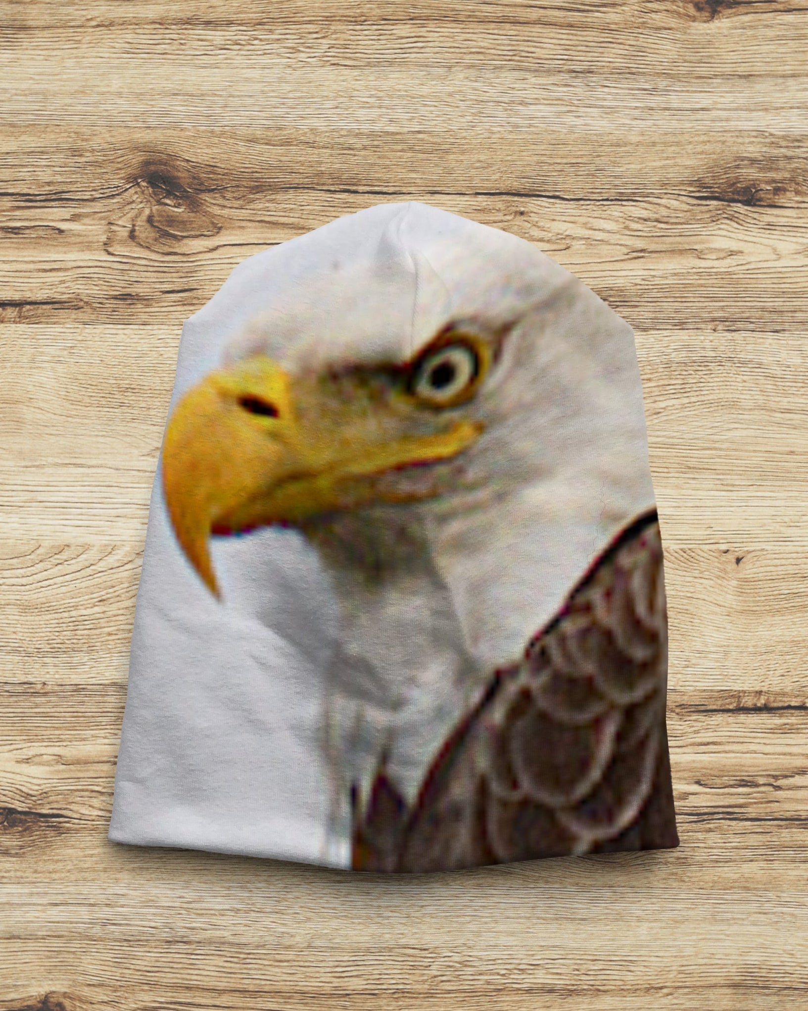Beanie with an eagle design on a wooden background