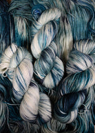 Teal green and gray hand dyed merino cashmere sock yarn.