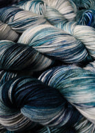 Teal green and gray hand dyed merino cashmere sock yarn.