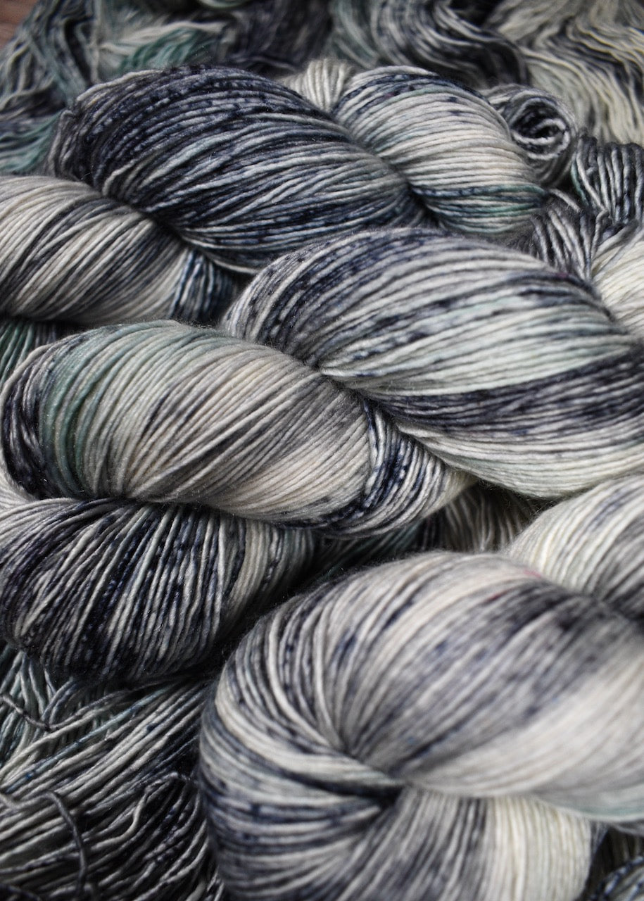 Speckled gray cashmere blend hand dyed yarn.