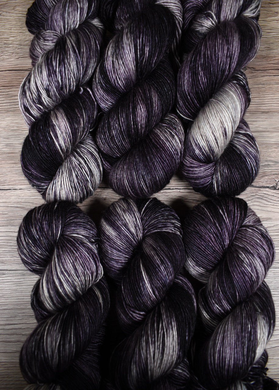 Purple merino and cashmere hand dyed yarn.