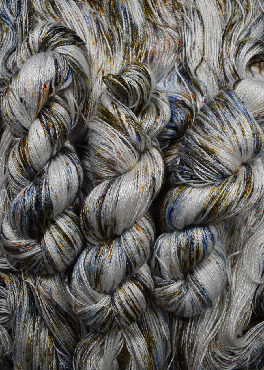 Speckled hand dyed bamboo sock yarn.