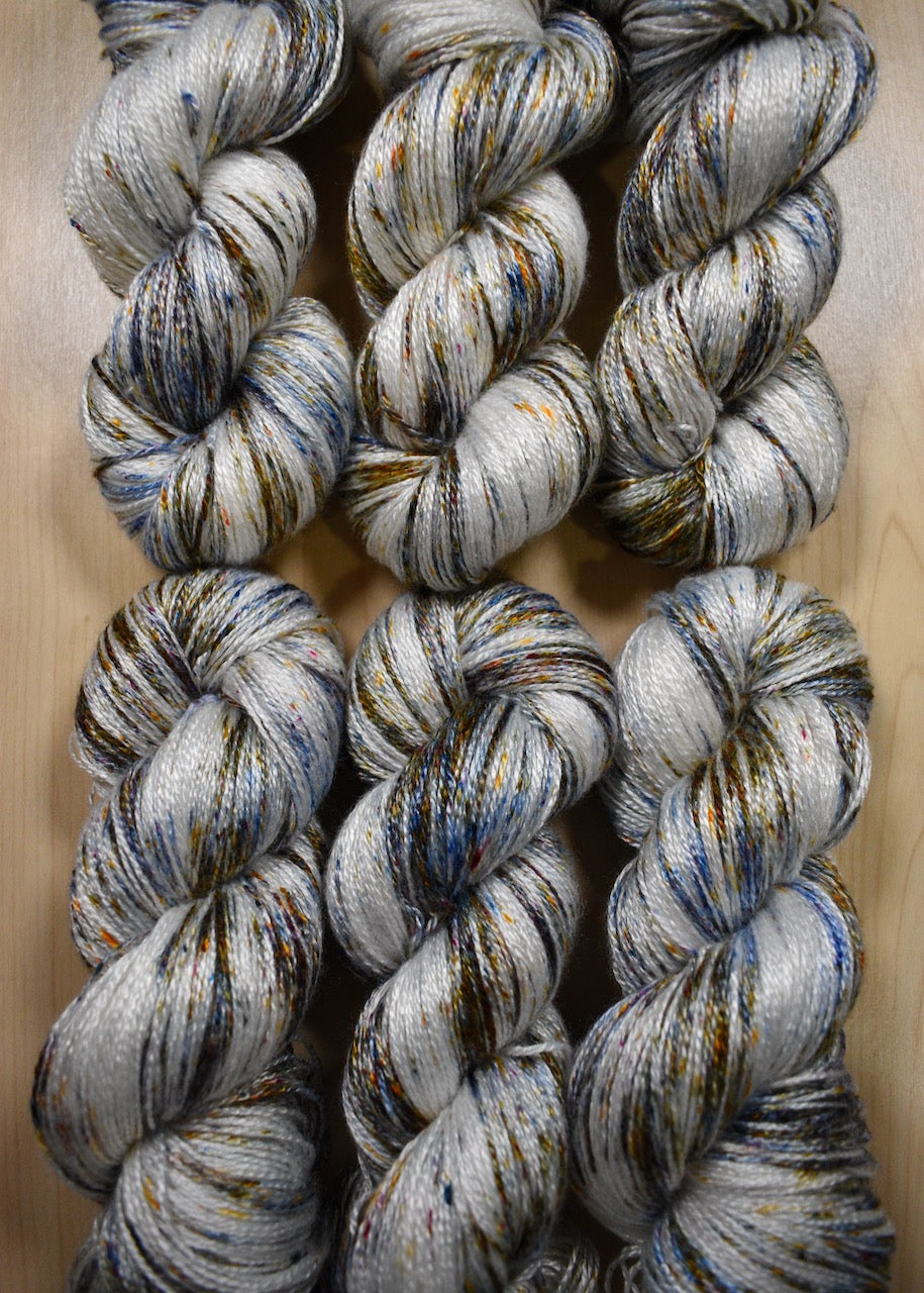 Speckled hand dyed bamboo sock yarn.