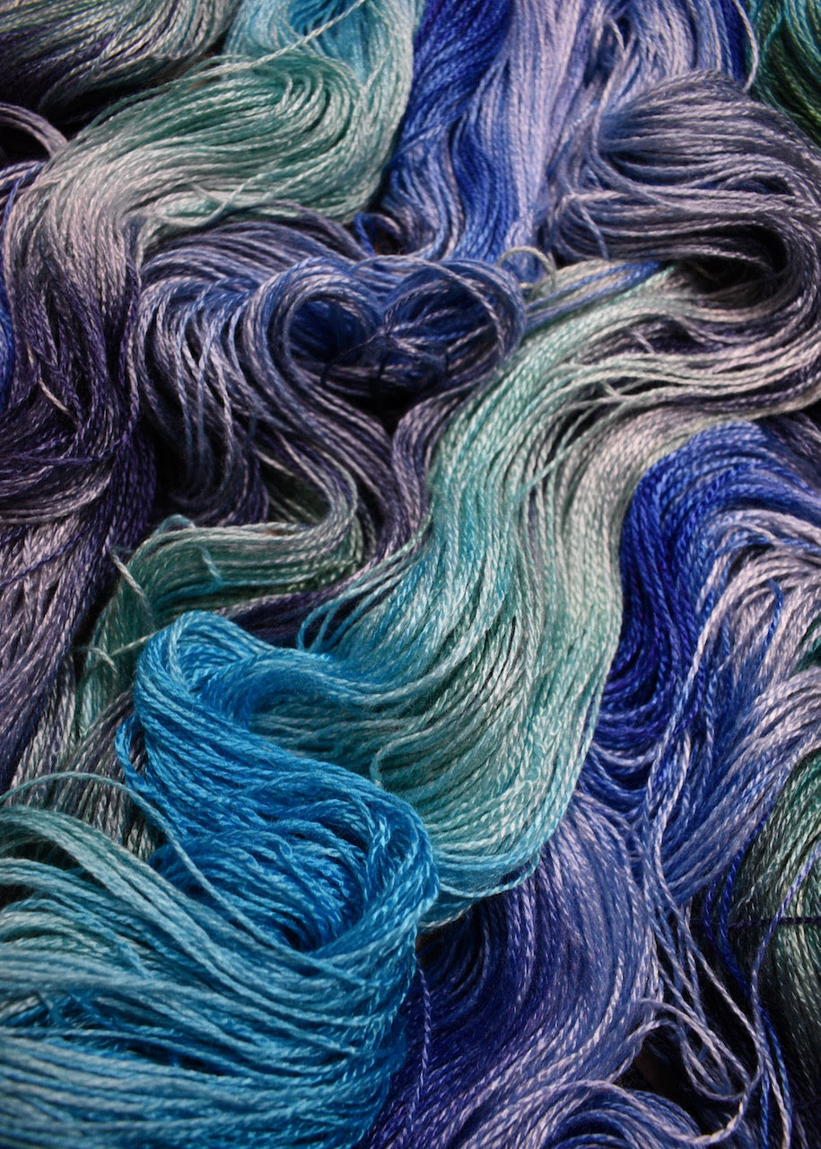 Hand dyed blue bamboo sock yarn.