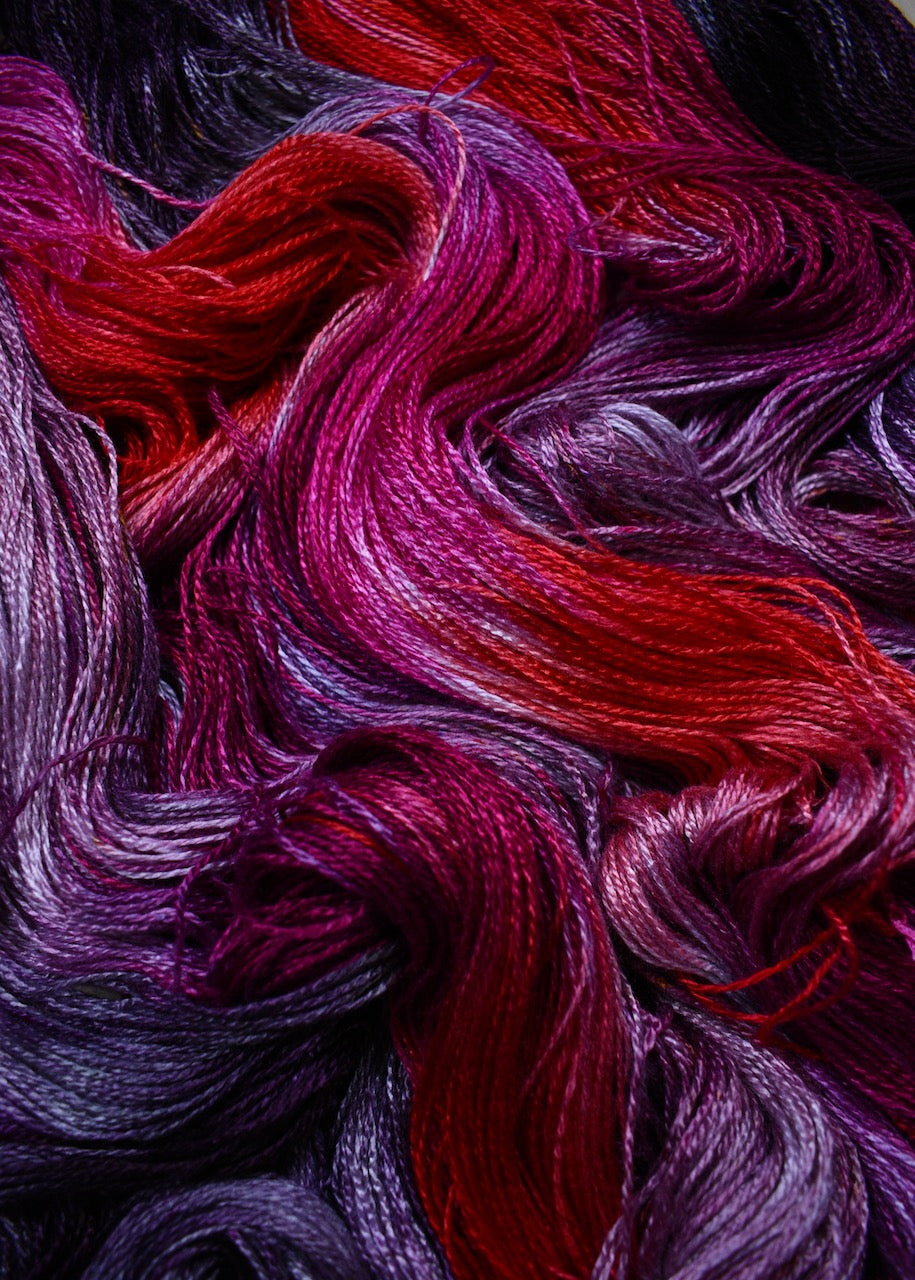 Hand dyed bamboo sock yarn in red colours.