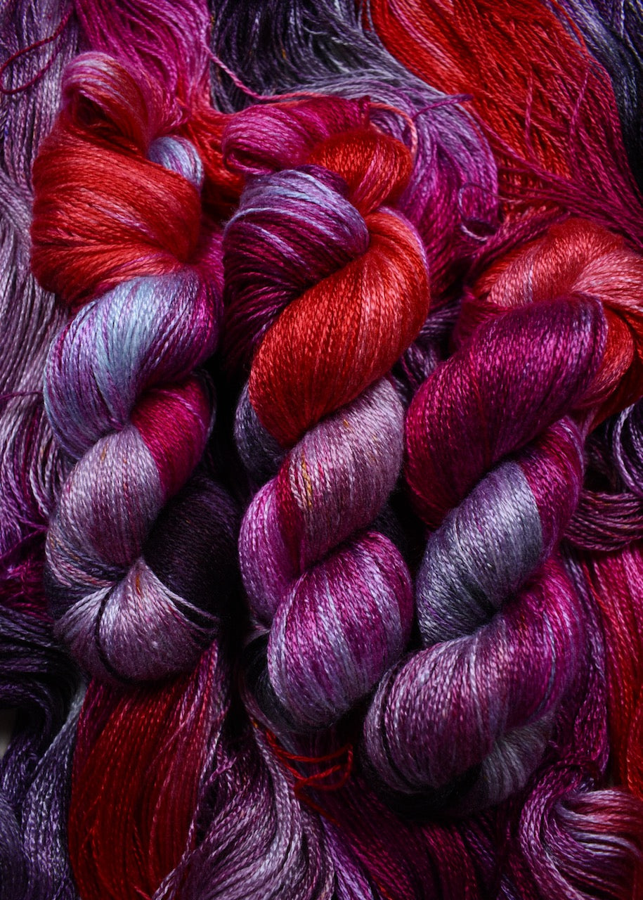 Hand dyed bamboo sock yarn in red colours.