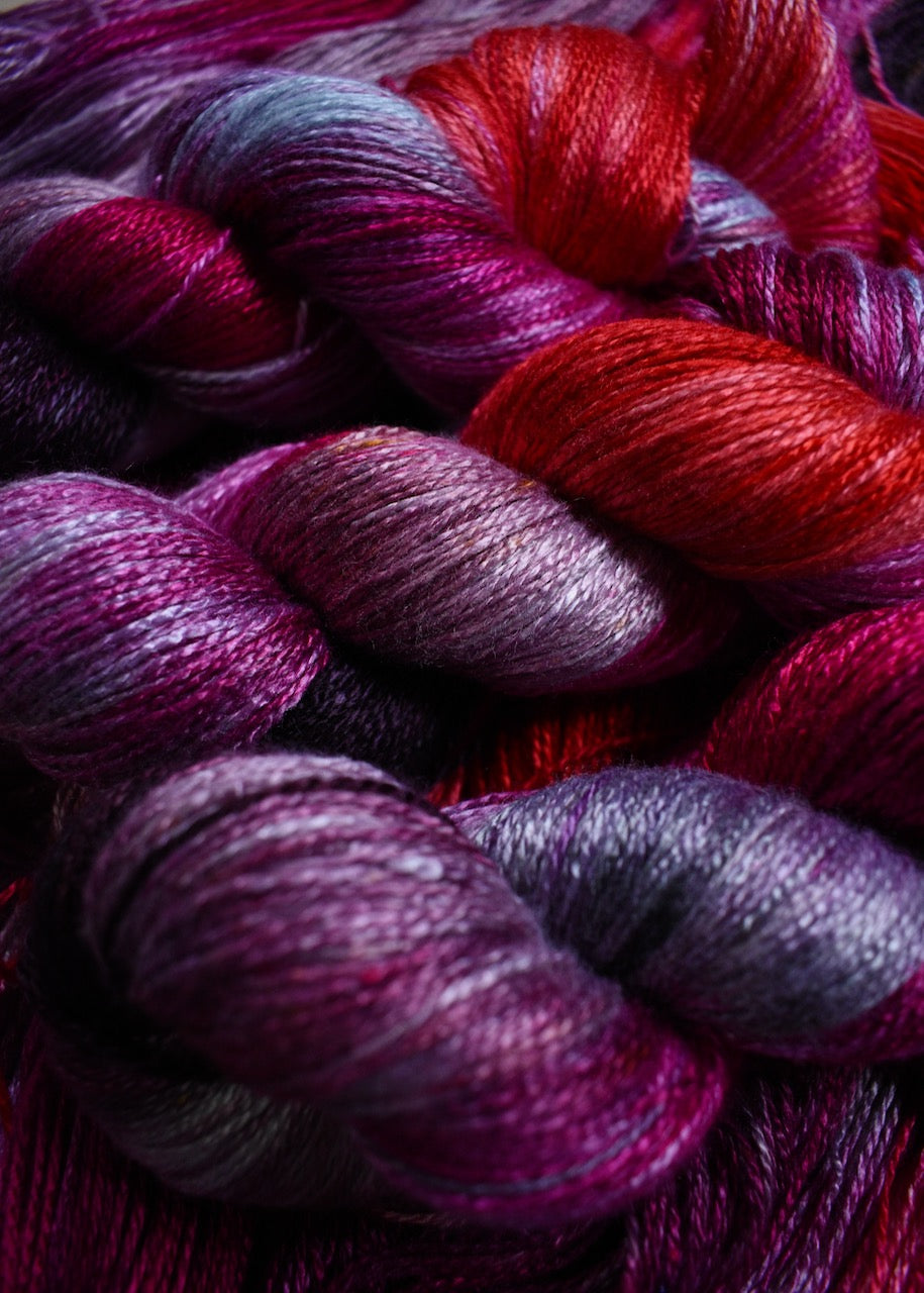 Hand dyed bamboo sock yarn in red colours.