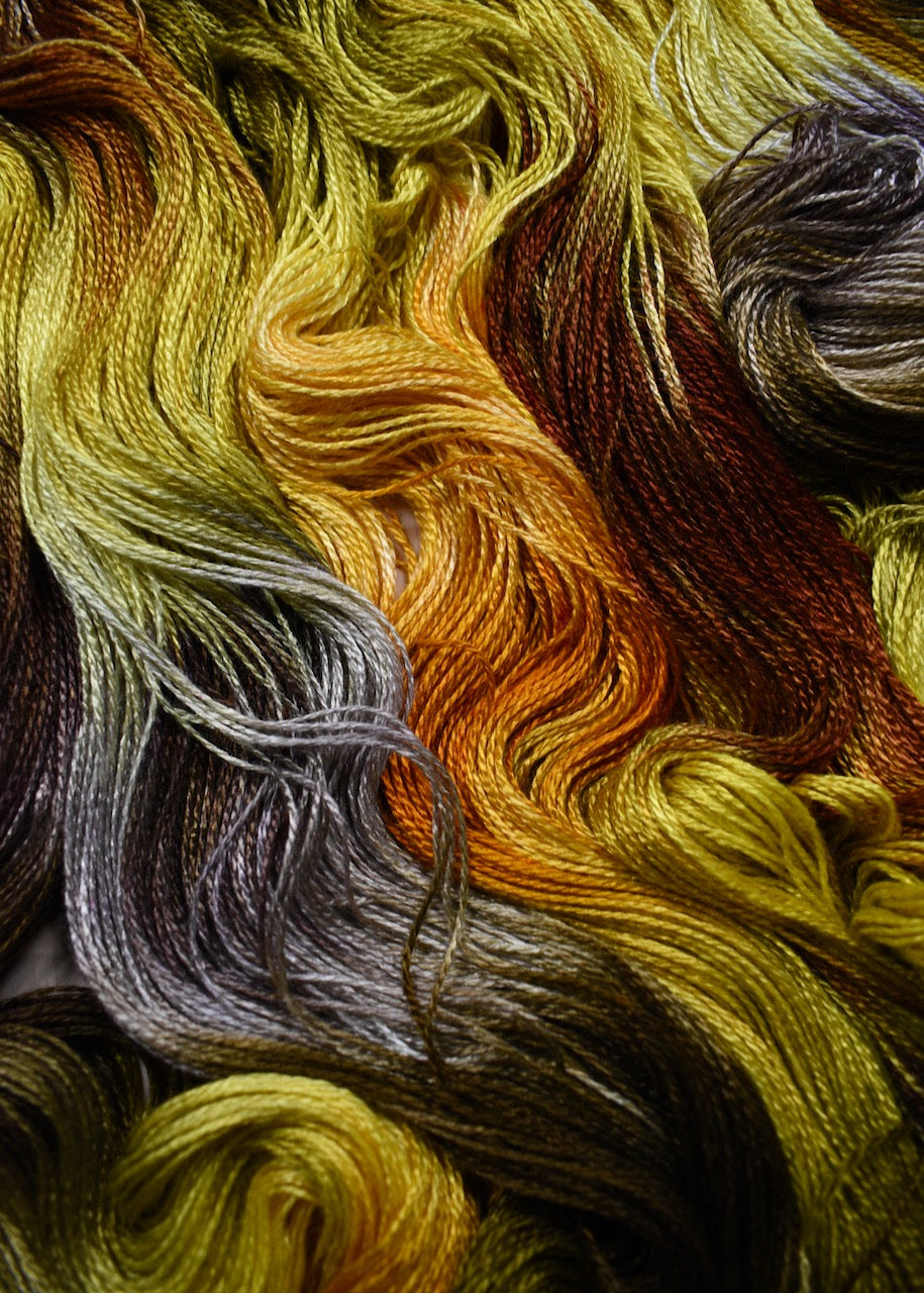 Hand dyed yellow bamboo sock yarn.