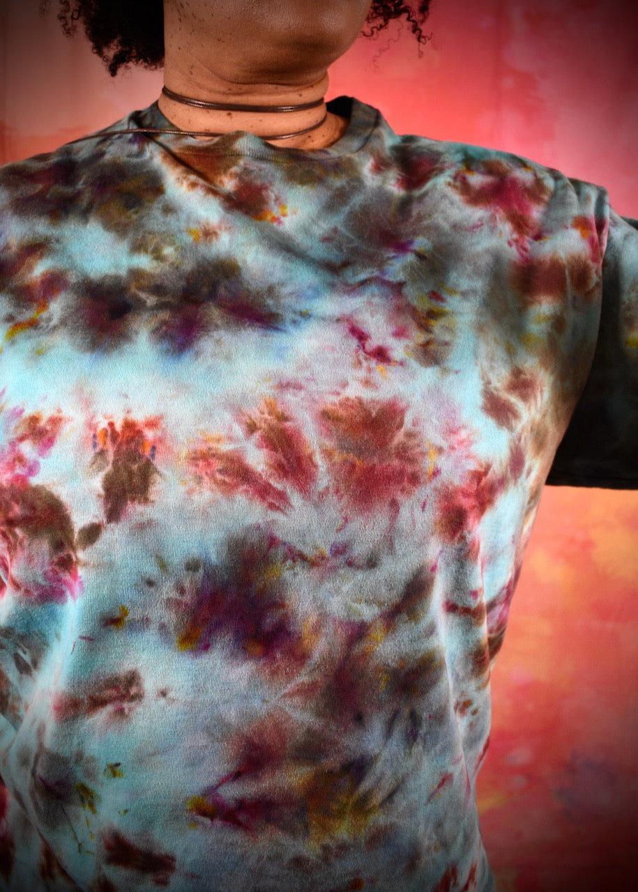 Hand dyed ice dye green turquoise and red cotton t-shirt.