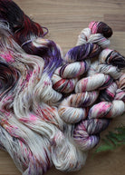 Pink, purple and orange coloured hand dyed merino cashmere sock yarn.