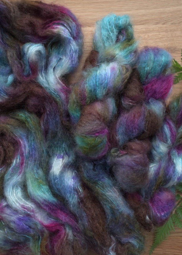 Blue hand dyed speckled mohair yarn.