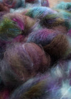 Blue hand dyed speckled mohair yarn.