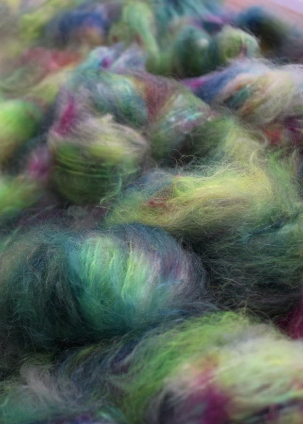 Hand dyed bright green speckled mohair yarn.