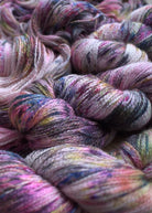 Pink speckled hand dyed silk and cashmere lace yarn.